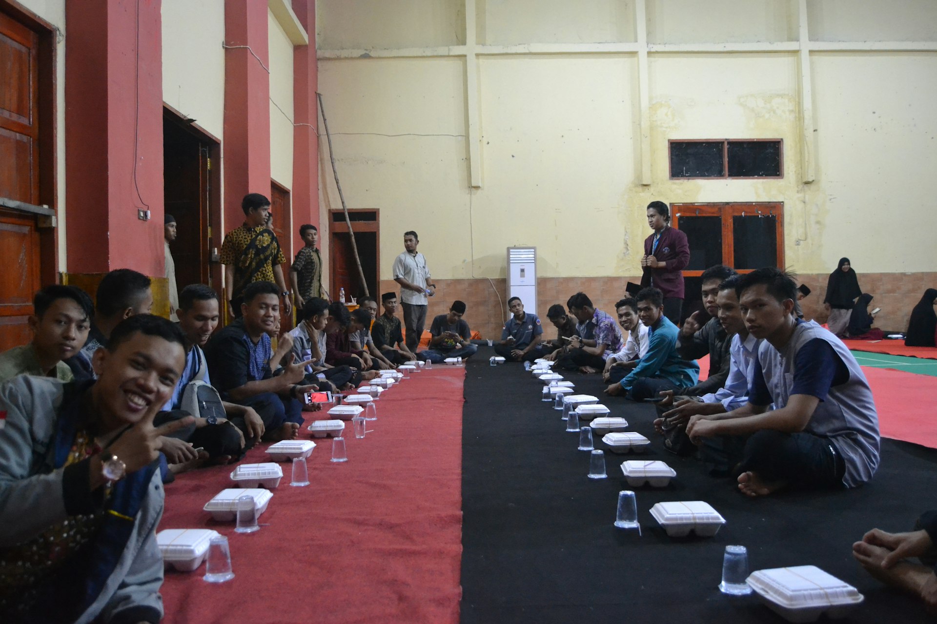 people sitting on black chairs